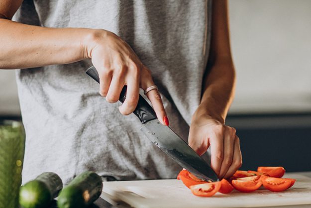 Woman cooking lunch at home